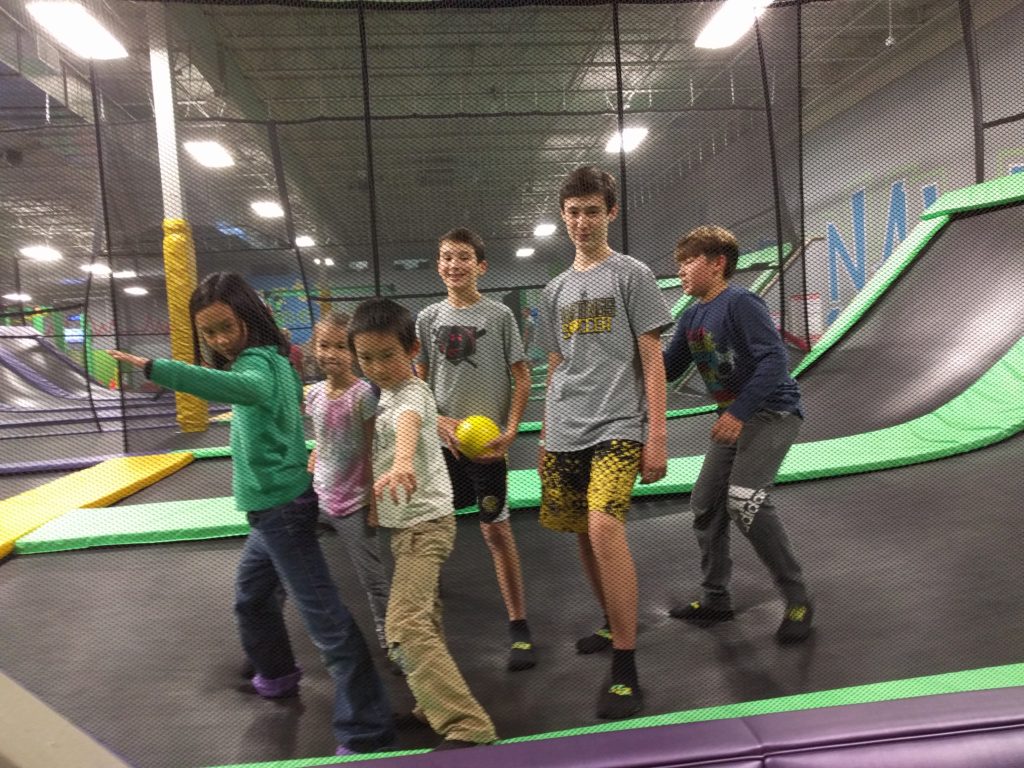 cousins hanging out at trampoline park